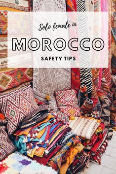 colorful carpets and rugs in morocco with text overlay reading self - made in morocco safety tips