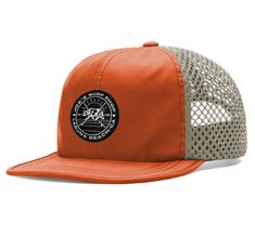 an orange and grey trucker hat with a black patch on the front