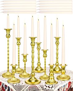 a table topped with lots of gold candles