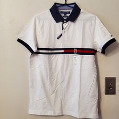 Nwt, Tommy Hilfiger Th Flex Polo In A Slim Fit. Sleeve Logo Monotone Logo On Front With Tri-Color Bar Detail Side Vents Length 27" Armpit To Armpit 19.75" 97% Cotton/3% Elastane - Machine Wash Tommy Hilfiger White Collared Top, White Collared Tommy Hilfiger Top, Tommy Hilfiger White Cotton Shirt, White Cotton Tommy Hilfiger Tops, Tommy Hilfiger White Cotton Tops, Tommy Hilfiger White Summer Shirt, Sporty Fitted Tommy Hilfiger Tops, Tommy Hilfiger Sporty Fitted Tops, Casual White Tommy Hilfiger Shirt