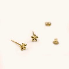 Cute mini daisy flower stud earrings handcrafted in 10K yellow gold. Made to Order Ship within 3-4 weeks - Earring size: 4mm- Sold as one pair. - The earrings come with 10K gold backings. - Made in 10 karat gold. - Stamp with 10K. Dainty 14k Gold Flower Earrings, Dainty 14k Yellow Gold Flower Earrings, Dainty Yellow Gold Flower Earrings, Delicate Tiny Gold Flower Earrings, Jewelry Minimal, Flower Stud Earrings, Flower Stud, Flower Earrings Studs, Flower Studs