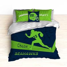 a football themed comforter set with green and blue accents