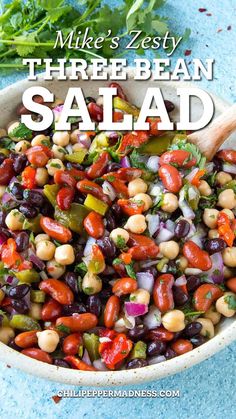 a white bowl filled with beans and vegetables