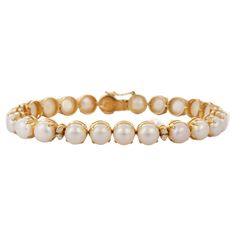 Pearl and Diamond bracelet in 18K Gold. It has a perfect round cut gemstone to make you stand out on any occasion or an event. A tennis bracelet is an essential piece of jewelry when it comes to your wedding day. The sleek and elegant style complements the attire beautifully, whether it's the bride wearing it herself, or as a gift to her bridesmaids to wear on the D’day. PRODUCT DETAILS :- > Material - 18K Solid Yellow Gold > Gemstone - Pearl > Stone Weight - 34.25 ct > Stone Shape - Round > Sto Luxury Round Pearl Bracelet, Luxury Gold Plated Jubilee Pearl Bracelet, Perfect Engagement Gifts, Modern Bracelets, Pearl Set, Birthstone Bracelets, Pearl Gemstone, June Birth Stone, Natural Pearls