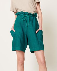 Green Linen Bottoms With Side Pockets, Linen Bottoms With Paperbag Waist, Linen Bottoms With Paperbag Waist And Elastic Waistband, Linen Bottoms With Paperbag Waist And Elastic Band, Linen Bottoms With Elastic Paperbag Waist, Casual Linen Paperbag Waist Bottoms, Linen Bottoms With Pockets And Paperbag Waist, Casual Linen Shorts With Tie Waist, Chic Cotton Drawstring Shorts