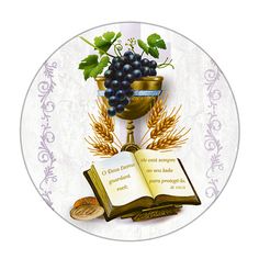 an open book and some grapes on a table with a chalicee next to it