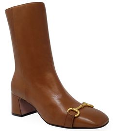 Description: The Madison Maison Cognac Leather Back Striped Boot is an modern, elevated, extremely comfortable boot with a contrasting horse-bit detail and a single stripe along the backside. Classic, comfortable and chic, this boot is perfect for all occasions. Color: Cognac with Gold Back Stripe Ankle Boot, Horse-bit Boot, Heeled Boot Composition: Leather Upper with Metal Horse-bit Detail Composition: Leather Lining Composition: Leather Sole Shaft height: 7.5 in / 19.05 cm Heel height: 2.0 in Metal Horse, Favorite Shoes, Joah Brown, The Madison, Horse Bits, Comfortable Boots, Brown Boots, Kids Bags, High Quality Leather