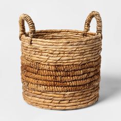 a large woven basket with two handles