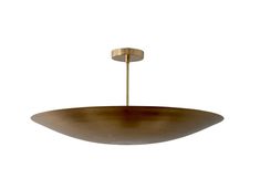 a large brass plated light fixture with a round metal bowl hanging from the ceiling