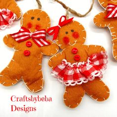 three gingerbread christmas ornaments with red and white gingham bows hanging from twine