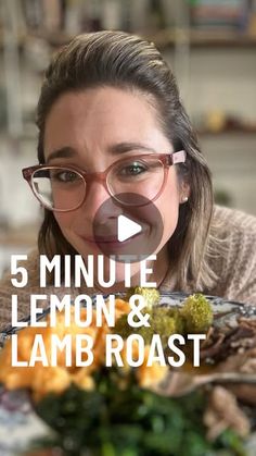 a woman with glasses is looking at the camera while eating lemons and lamb roast