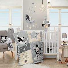 a baby's room with mickey mouse bedding