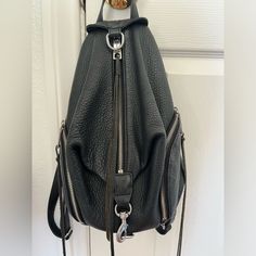 Genuine Leather - Size Medium 30" Adjustable Shoulder Strap 3 Exterior Zipper Pockets Top Zipper With Clasp Closure 1 Interior Slip Pocket And 1 Zip Pocket In Overall Great Shape! Noticeable Signs Of Wear Pictured Price Reflects Rebecca Minkoff Julian Backpack, Pocket Top, Rebecca Minkoff, Zipper Pocket, Zip Pockets, Overalls, Shoulder Strap, Genuine Leather, Bag Lady