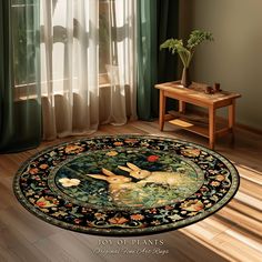 a round rug with an image of two rabbits on it in front of a window