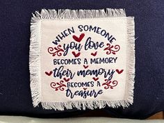 a pillow with embroidered words on it that says when someone you love becomes a memory, their memory becomes a dream