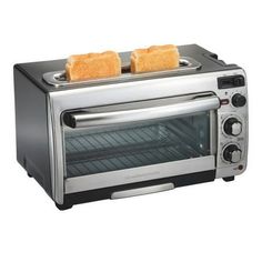 two toasters are sitting on top of each other in front of an open oven