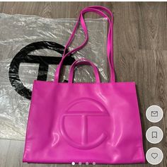 Large Telfar Bag W/ Zipper Pouch Inside - Vegan Leather - Comes W/ Dust Bag & Plastic Bag Color: Hot Pink/ Azalea Condition: Good; Small Wear Marks On Bottom Corners Of Bag (Can Use Angelus Leather Paint) Size: Height 14 3/4", Width 19 1/4", Depth 7", Strap Drop 21", Handle Drop 5 1/2" *Bag Is Sanitized Before Shipping* Large Telfar Bag, Telfar Bags, Telfar Bag, Pink Azaleas, Leather Paint, Large Bags, Zipper Pouch, Plastic Bag, Vegan Leather