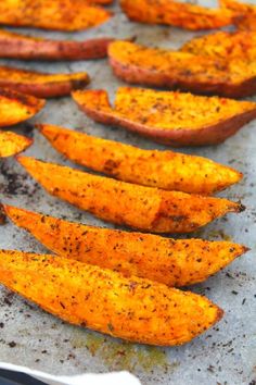 baked sweet potato wedges on a baking sheet