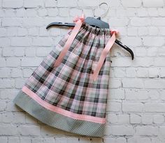 This gray and pink plaid pillowcase dress is a favorite of every little girl.  My pillowcase dresses are sized to be tea length. If you would like it shorter let me know the measurement in the note to seller.  Pillowcase dresses are timeless in their wear. Once they are too short for a dress, loosen the ties and let your little one wear it as a top wit her favorite leggings or shorts. For the perfect fit, measure from the shoulder to the desired length. 12 Month - 15 inches 18 Month - 17 inches Pink And Grey Dress, Upcycle Dress, Tea Party Dress, Pillowcase Dress, Girly Dresses, Diy Sewing Pattern, Little Girl Dresses, Pink Plaid, Toddler Dress