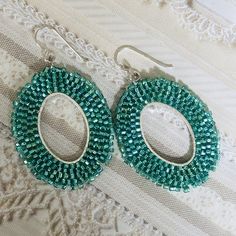 Simply beautiful beaded dangle earrings made with gorgeous light emerald 11.0 seed beads. The french hook earwires are sterling silver. These very lightweight earrings are handmade with each tiny bead individually woven. They measure 2 inches total including the earwires. The hoops are 1.5 inches. Great for daywear and stunningly chic for all occasions. Click below to see more beautiful items from Work of Heart Shop Home https://www.etsy.com/shop/workofheart Thanks for shopping at Work of Heart Elegant Teardrop Earrings With Tiny Beads, Elegant Turquoise Beaded Earrings With Tiny Beads, Elegant Turquoise Beaded Earrings, Green Oval Beaded Jewelry, Oval Green Beaded Jewelry, Elegant Oval Beaded Earrings As Gift, Elegant Oval Beaded Earrings For Gift, Elegant Oval Beaded Earrings, Green Teardrop Earrings With Tiny Beads