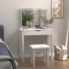 a bedroom with a white vanity table and stool