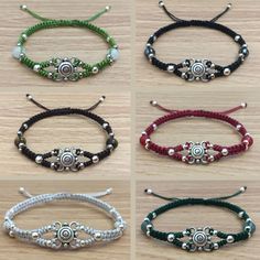 four different bracelets with beads on them