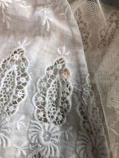 "Antique Edwardian white cotton lawn dress has eyelet lace embroidery throughout the bodice, sleeves, and around the hem. The dress has a ruffle trimmed net collar and net under bodice that has a crossover snap detail. The dress has snap and hook and eye closures at the skirt and bodice. Condition Overall excellent. There's a repair to the right sleeve, and orange stains near the seam. The front skirt has stains at the hem, the back skirt has some stains near the top of the lace, and yellowing a White Cotton Lace Dress With Lace Work, White Cotton Victorian Dress For Wedding, White Cotton Victorian Dress For Summer, White Lace Victorian Dress For Spring, White Victorian Dress With Lace Collar For Spring, White Victorian Dress With Lace Trim For Spring, White Lace Victorian Dress For Summer, White Elegant Victorian Dress With Broderie Anglaise, White Regency Style Broderie Anglaise Dresses