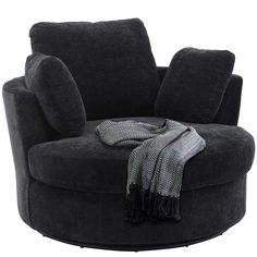 a black chair with a blanket on it