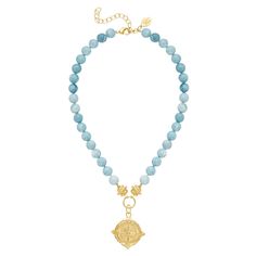 From beach to baby shower to boardroom, the Nellie Necklace will take you anywhere. Inspired by Nellie Bly, who traveled the world in a record-breaking 72 days in 1889, this necklace is made of swirling soft blue Jasper beads with your choice of gold pendant. Simultaneously bold and feminine, the Nellie Necklace adds effortless polish to any occasion. Elegant Blue Necklace With Coin Pendant, Blue Medallion Necklace With Coin Pendant, Blue Beaded Medallion Necklace, Blue Necklaces With Large Pendant And Round Beads, Medallion Necklaces With Gemstone Beads As Gift, Gold Necklace With Large Pendant And Round Beads, Nellie Bly, Blue Jasper, Compass Necklace