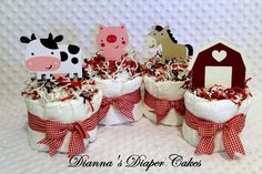 several small baskets filled with cake and farm animals on top of each other in front of a white background