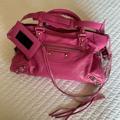 Medium Size, Pre Loved, Looks Brand New. Includes Dust Bag. See Pictures For Authentication Code. Designer Pink Bag With Removable Pouch, Designer Pink Bags With Removable Pouch, Designer Pink Bag With Dust Bag, Designer Pink Shoulder Bag For Travel, Designer Pink Bags With Dust Bag, Designer Pink Bags For Travel, Designer Pink Satchel For Travel, Trendy Pink Bag With Silver-tone Hardware, Trendy Pink Shoulder Bag With Silver-tone Hardware