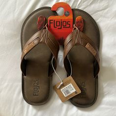 Brand New Never Worn. Dark Brown / Tan. Brown Synthetic Round Toe Flip Flops, Brown Casual Slip-on Flip Flops, Comfortable Brown Round Toe Flip Flops, Comfortable Brown Flip Flops, Casual Brown Flip Flops With Leather Footbed, Casual Brown Leather Flip Flops, Brown Casual Flip Flops With Cushioned Footbed, Casual Brown Flip Flops With Cushioned Footbed, Brown Cushioned Flip Flops With Round Toe