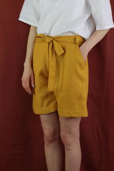 "Women linen shorts with 2 pockets in mustard color, perfect for casual wear and suitable for any occasion in any season Details: - 100% natural linen produced in Europe ; - medium weight (180 gram per square meter); - color: mustard, can be any from our colors catalogue (color samples at the photo); Made to order, approximately a few days, If you have any questions please message me and I will be glad to answer. Size guide : Size XS Bust: fits bust around 33\"-34\"/ 84-88 cm Waist: fits waist a Yellow Relaxed Fit Shorts For Summer, Relaxed Fit Yellow Shorts For Summer, Yellow Bermuda Shorts For Summer, Spring Yellow Shorts With Pockets, Yellow Shorts With Pockets For Spring, Solid Linen Shorts With Built-in Shorts, Solid Linen Shorts, Yellow Linen Bottoms For Spring, Yellow Bermuda Bottoms For Summer