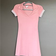 Sporty/Athletic Style Lightweight Above Knee Dress With A-Line Neck And Fold Down Collar. Double White Striped Sleeve. From Neckline To Hem Is 25 Inches And Back Top Collar To Hem Is 33 Inches Approximately. Polo Style Mini Dress With Sporty And Casual Look. Never Worn. Sporty White V-neck Dress, Pink Fitted Tennis Dress For Sports, Fitted Pink Tennis Dress For Sports, Summer Sporty Pink Tennis Dress, Spring Fitted Mini Dress For Casual Wear, Pink Stretch Tennis Dress In Athleisure Style, Casual Short Sleeve Stretch Tennis Dress, Casual Tennis Dress With Short Sleeves And Stretch, Fitted Casual Summer Activewear