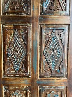 an old wooden door with intricate carvings on it