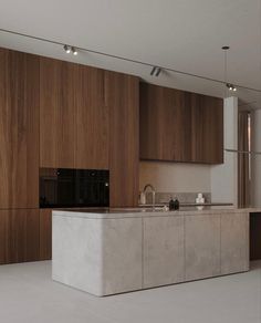 a large kitchen with wooden cabinets and white flooring, along with an island in the middle