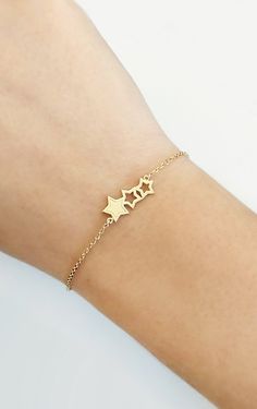 14K Gold Triple Star Bracelet, Solid gold bracelet, Dainty gold bracelet, Wish star bracelet, Gift for her, Stars bracelet, Rose Gold bracelet, 9K Gold bracelet, Delicate gold bracelet Beautiful and delicate bracelet with a triple star charm made in 14K or 9K solid gold. Remember to reach for the stars, and they won't be able to resist flying into your hands! Whsiper...Make a wish! -------------------------------------------------- D E T A I L S 14K Solid Gold or 9K Solid Gold Charm dimensions: 14k Gold Bracelet With Star Charm, 14k Gold Star-shaped Bracelet Gift, 14k Gold Star Bracelet Gift, 14k Gold Star Charm Bracelet, Gold Star Chain Bracelet As Gift, 14k Gold Bracelets With Star Charm, Yellow Gold Star Bracelet As Gift, Yellow Gold Star Bracelet For Gift, Yellow Gold Star-shaped Bracelet For Gift