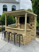 an outdoor bar with stools and barstools in front of a fenced area