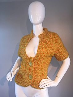 For Sale on 1stDibs - Wonderful 1960s B.H WRAGGE burnt orange boucle short sleeve jacket! Mod style, with an Avant Garde cut-out at the bodice. Two oversized buttons down the Fitted Retro Wool Top, Retro Fitted Wool Top, Fitted Wool Retro Tops, 60s Retro, Retro Jacket, Mod Style, Short Sleeve Jacket, Mod Fashion, Sleeve Jacket