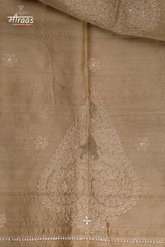 This handwoven Tussar Silk and is hand embroidered with Chikankari. It is light & all weather. The stole is certified by Silk Mark of India for its purity. THE SUSTAINABILITY QUOTIENT (TSQ): 1. RESHAM FINE CHIKANKARI 2. ANTIQUE MOTIF OF EMBROIDERY 3. HANDLOOM TUSSAR SILK STOLE 4. BIO WASHED (COMPLETELY ELIMINATING TRADITIONAL ACID WASH METHOD) KHAYAL (moodboard): Paan, the rarely used, yet as significant a symbol of Awadh's iconography. The broad spectrum of Paan (Betel Leaf) provides platform for artistry, which ancient artisans used to fill with mystique & romance through their skilled artwork. POSHAAK (about the outfit): Handloom Tussar Silk stole embroidered with Antique Chikankari with Betel leaf or Paan motif. A beautiful souvenir from the Handloom & Handicraft Industry of India. Luxury Chikankari Embroidered Shawl In Traditional Drape, Wedding Shawl With Chikankari Embroidery In Pashmina, Festival Pashmina Shawl With Chikankari Embroidery, Beige Jamawar Dupatta With Intricate Embroidery, Festive Cream Shawl With Chikankari Embroidery, Jamawar Pashmina Shawl With Chikankari Embroidery For Festive Occasions, Pashmina Shawl With Chikankari Embroidery For Wedding And Festivals, Beige Pashmina Shawl Dupatta For Wedding, Wedding Pashmina Shawl With Chikankari Embroidery For Festivals