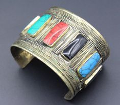 Vintage Turkmen traditional alpaka bracelet. Its 100% hand crafted workmanship with beautiful colorful enamel beads and lovely carved design. Please do not hesitate to contact if you have any questions. Weight : 58.5 grams, Opening of the mouth : 1.6" ( 4 cm ) Inner circumference : 14 cm ( 5.5" ) Width : 4cm ( 1.6" ) Please know what you are bidding on. The metal of Most Kuchi, Afghan and Turkoman items are called with different names, Some called Alpaca silver, German Silver and Tibetan Silver. Adjustable Multicolor Ceremonial Jewelry, Adjustable Multicolor Jewelry For Ceremonial Occasion, Multicolor Nickel-free Bracelets For Festivals, Nickel-free Multicolor Festival Bracelets, Traditional Nickel-free Cuff Bracelet As Gift, Traditional Nickel-free Cuff Bracelet Gift, Traditional Multicolor Adjustable Cuff Bracelet, Adjustable Multicolor Traditional Cuff Bracelet, Traditional Multicolor Cuff Bracelet As Gift