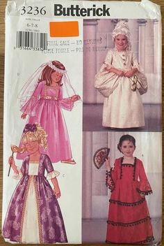 two children's dresses, one in pink and the other in purple