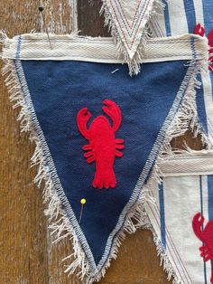 two pieces of cloth with red crabs on them