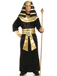 an egyptian man dressed in black and gold with his hands on his hips, holding a staff