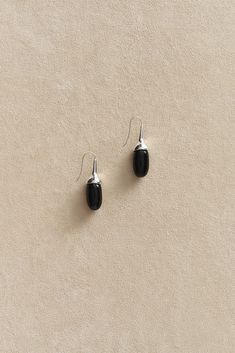 Dripping Stone Earrings In Onyx Black Onyx Earrings With Polished Finish, Sleek Sterling Silver Jewelry For Formal Occasions, Black Enamel Sterling Silver Drop Earrings, Sterling Silver Drop Earrings With Black Enamel, Sterling Silver Black Enamel Drop Earrings, Polished Onyx Earrings For Gift, Elegant Onyx Earrings With Polished Finish, Modern Black Sterling Silver Earrings, Classic Black Enamel Sterling Silver Earrings