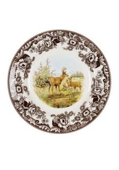 a brown and white plate with two deers on it