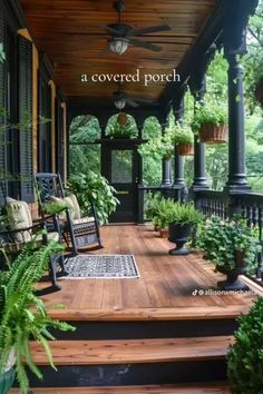 a porch covered in lots of plants next to a wooden deck with two rocking chairs on it