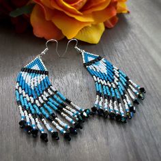 Southwestern inspired beaded fringe earrings made with Miyuki Delica Beads and Preciosa crystal beads. Southwestern Fringe Earrings With Round Beads, Bohemian Crystal Earrings With Faceted Beads, Southwestern Beaded Fringe Dangle Earrings, Southwestern Style Beaded Fringe Dangle Earrings, Bohemian Beaded Crystal Earrings, Beads With Beaded Fringe For Jewelry Making, Artisan Beaded Fringe Dangle Earrings, Dangle Beads With Beaded Fringe For Jewelry Making, Bohemian Beaded Round Crystal Earrings