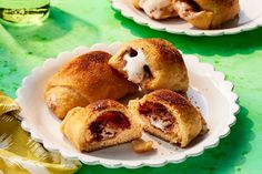 some pastries are on a white plate with green table cloth and yellow napkins