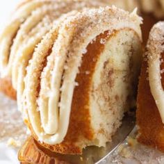 a close up of a cake on a plate with a fork